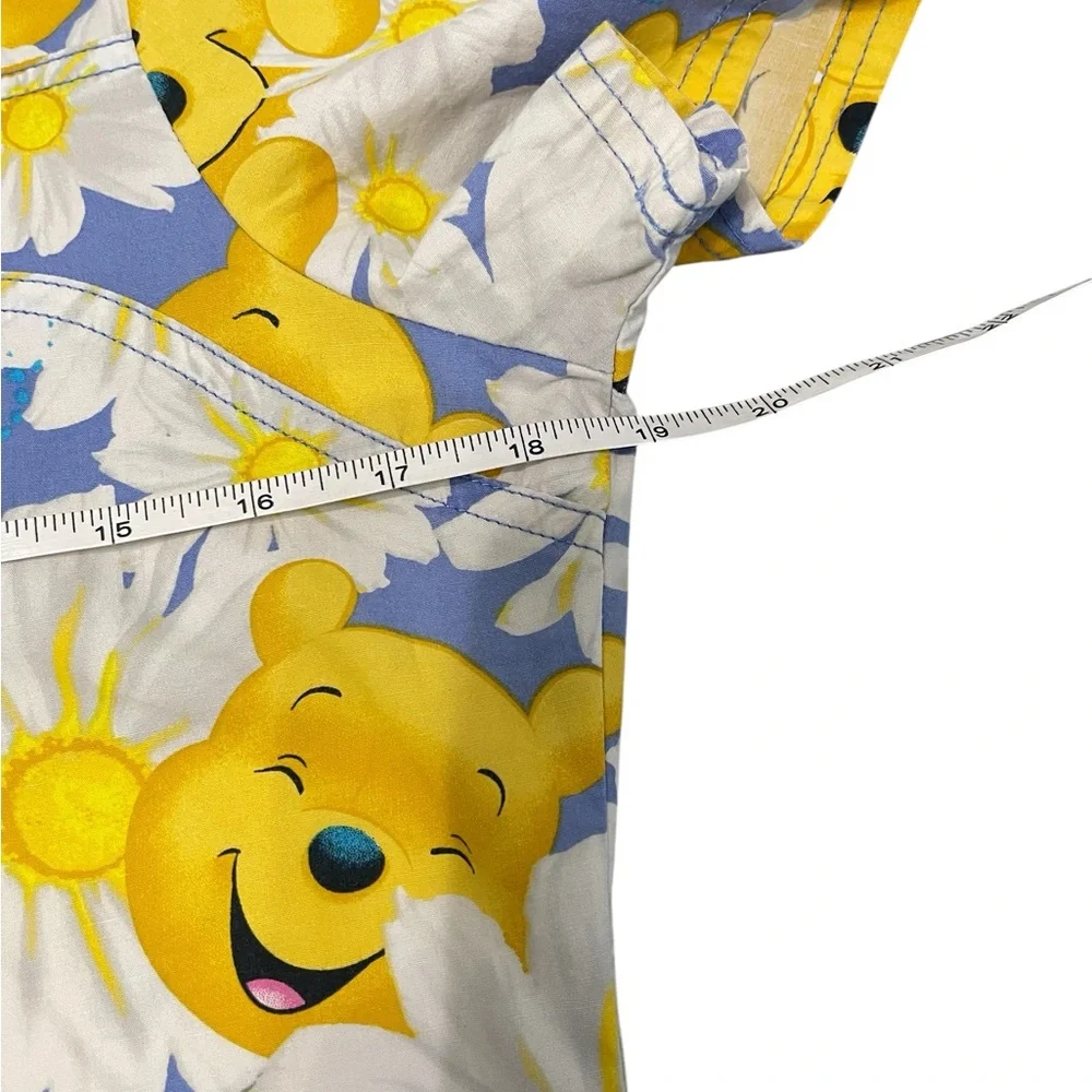 Disney Blue and Yellow Floral Print Adult Woman’s Scrub.
Size S - Picture 9 of 13